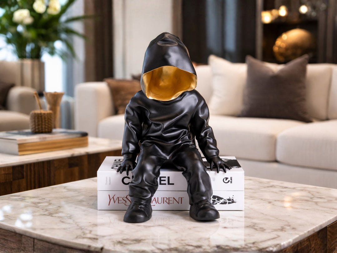 Black Hooded Gold-Faced Figurine