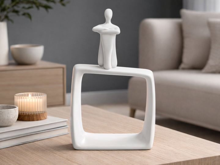 White Ceramic Art Sitting Alone Man