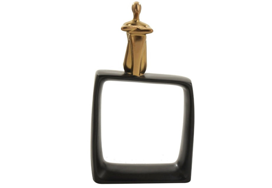 A high-quality ceramic figure statue with a gold human figure on a glossy black cubic block, designed for home decor.