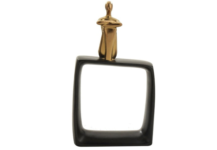 A high-quality ceramic figure statue with a gold human figure on a glossy black cubic block, designed for home decor.
