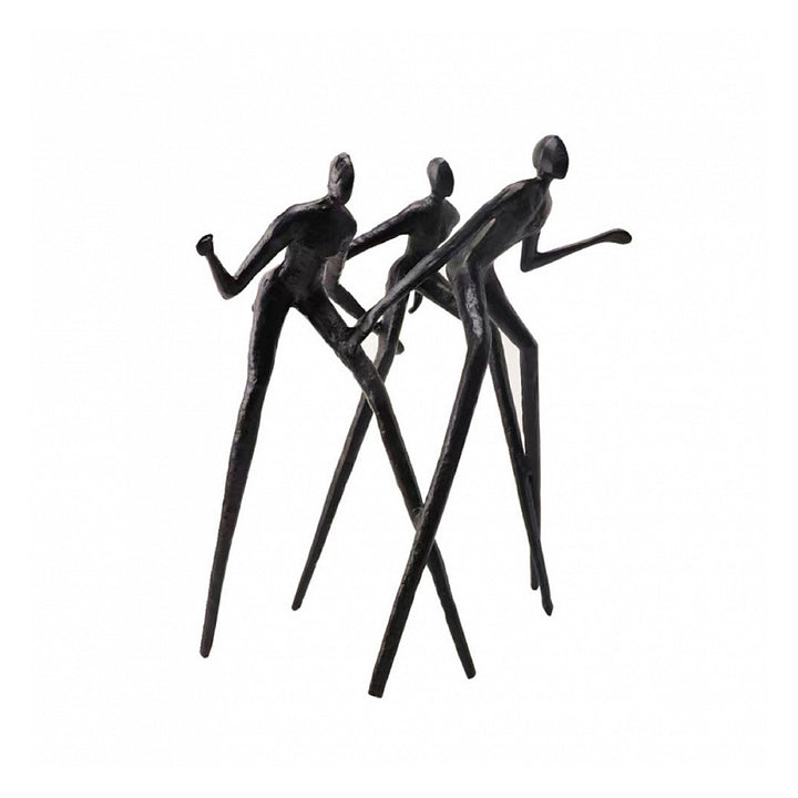 Black abstract sculpture of three figures in a dynamic pose on a white background