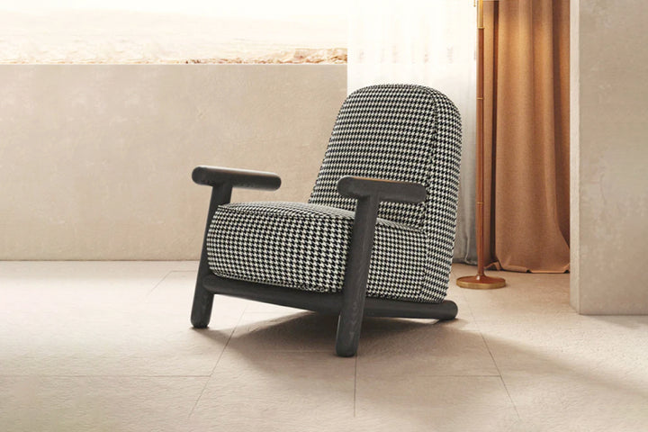 Patterned armchair in a room with a neutral color scheme