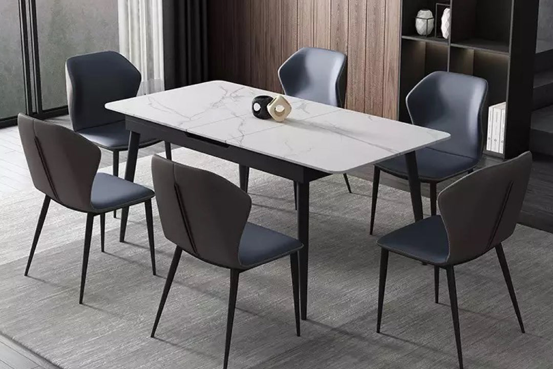 Dining table set with six chairs in a modern room.