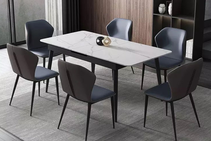 Dining table set with six chairs in a modern room.