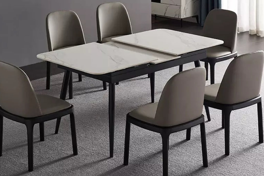 Dining table with six chairs in a gray color scheme.