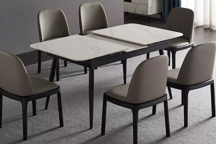 Dining table with six chairs in a gray color scheme.