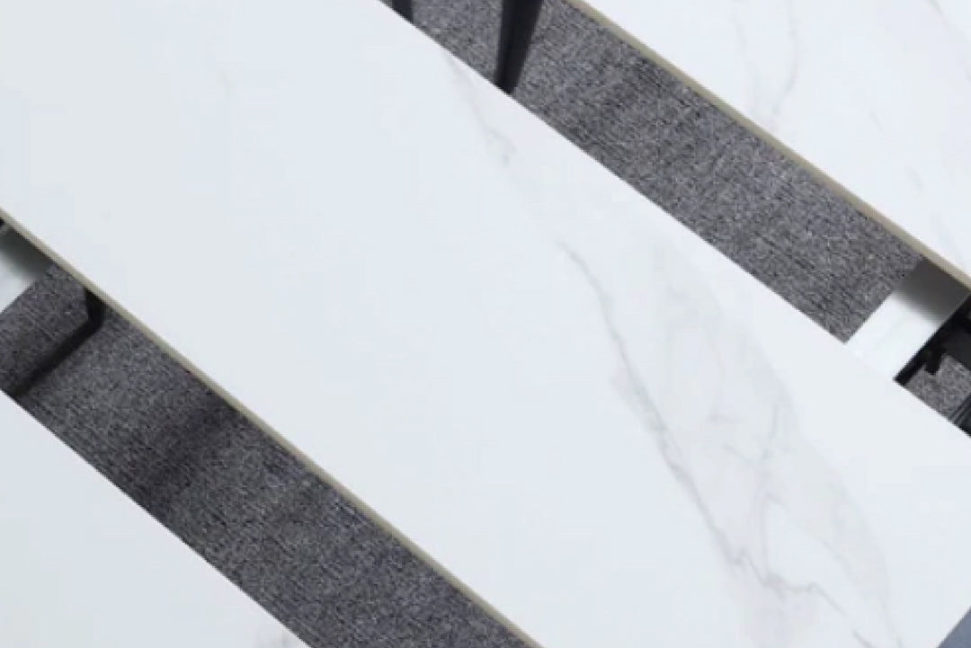 Close-up of a marble and gray fabric surface.