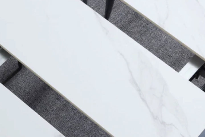 Close-up of a marble and gray fabric surface.