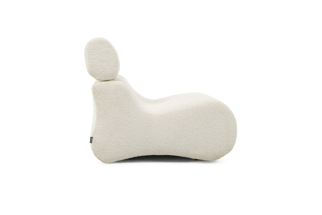 White knitted animal-shaped pillow on a white background