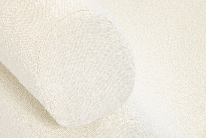 Close-up of a white mattress topper with a soft texture.