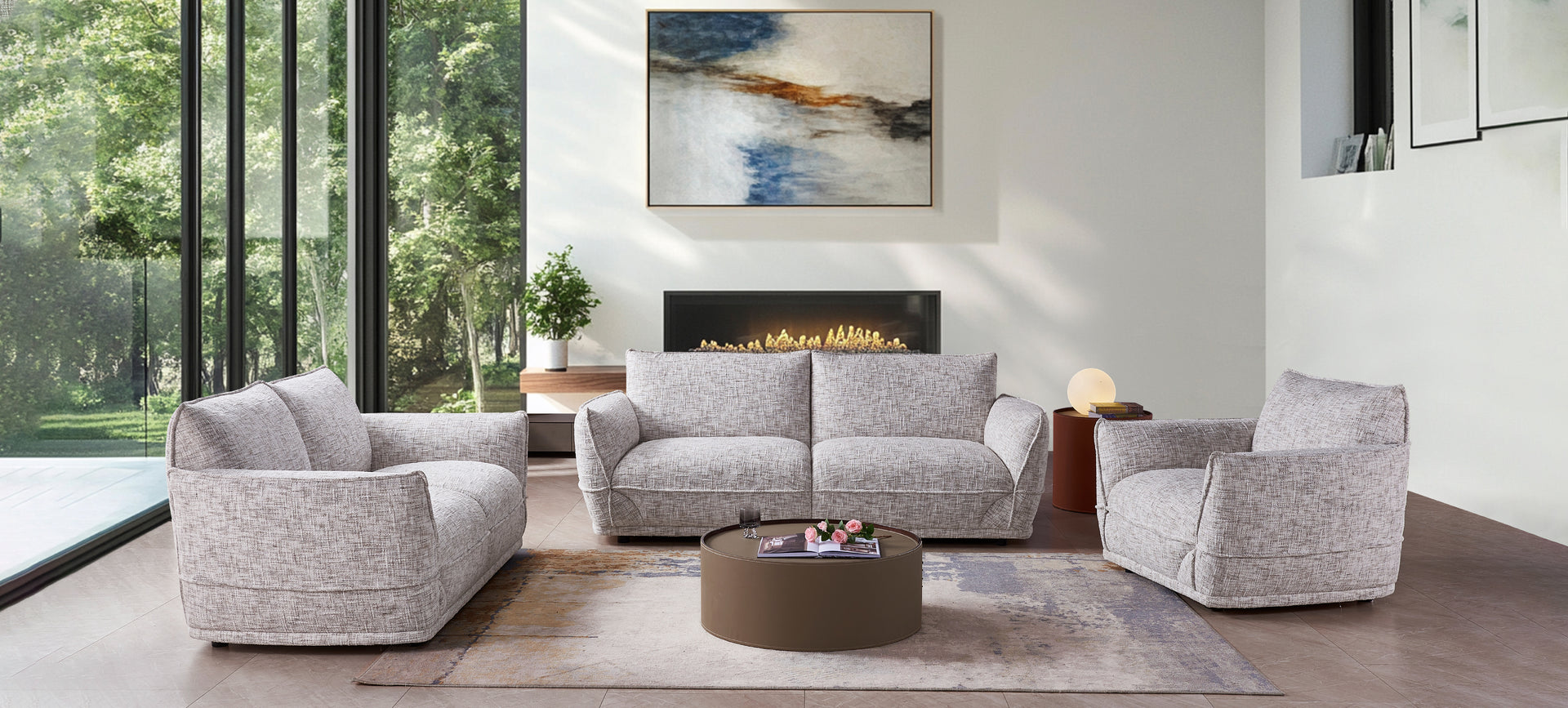 Modern living room with gray sofa, armchairs, and a coffee table.