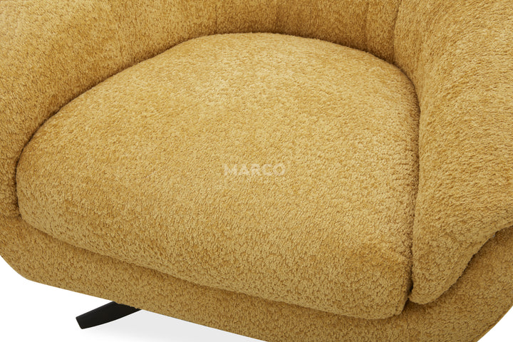 Close-up of a beige upholstered chair with 'HARCO' branding.