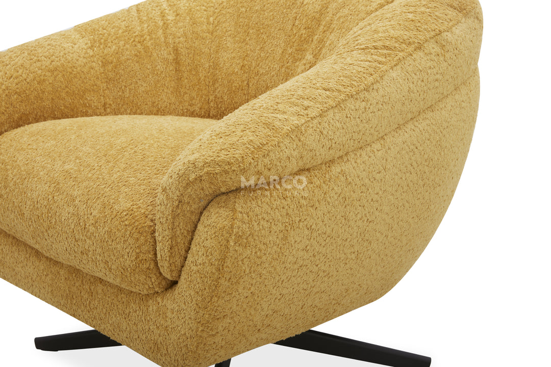 Gold upholstered chair with 'Marco' branding on a white background