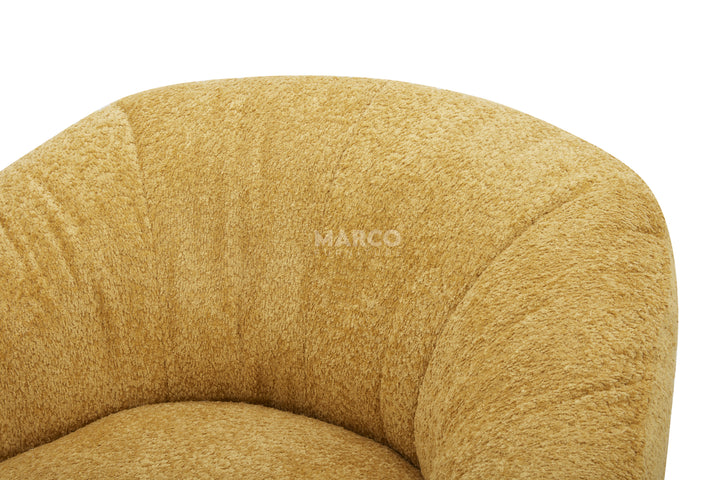 Close-up of a textured yellow chair with 'Mango' branding on a white background