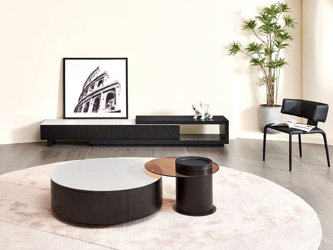 Modern living room with a sound system, coffee table, and chair.