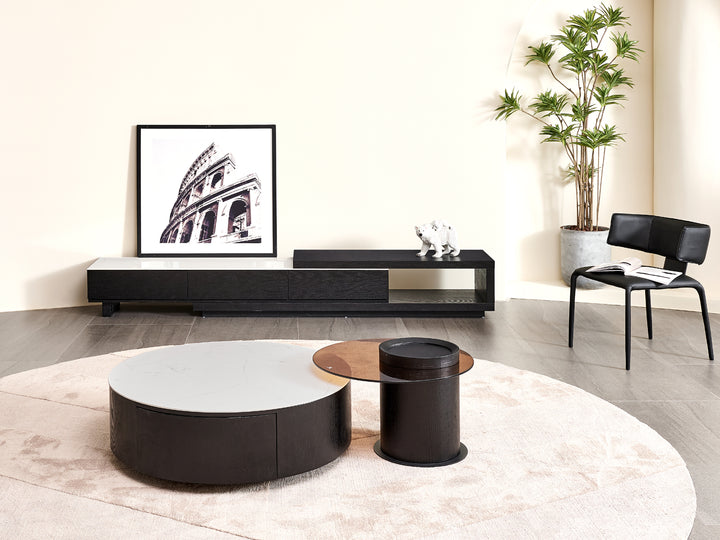 Modern living room with a sound system, coffee table, and chair.