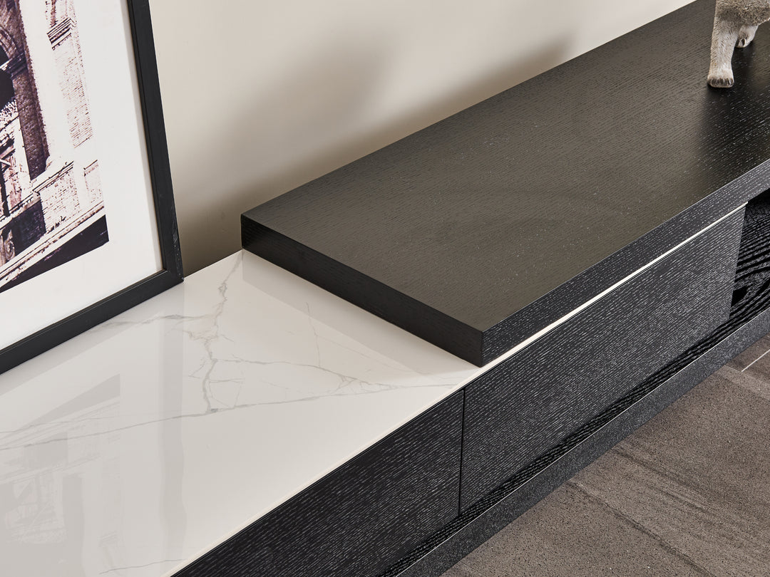 Modern black and white entertainment console with marble finish.