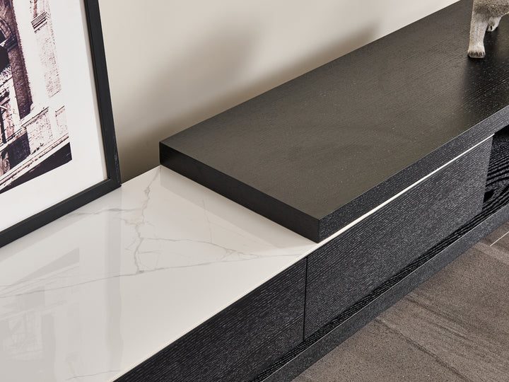 Modern black and white entertainment console with marble finish.