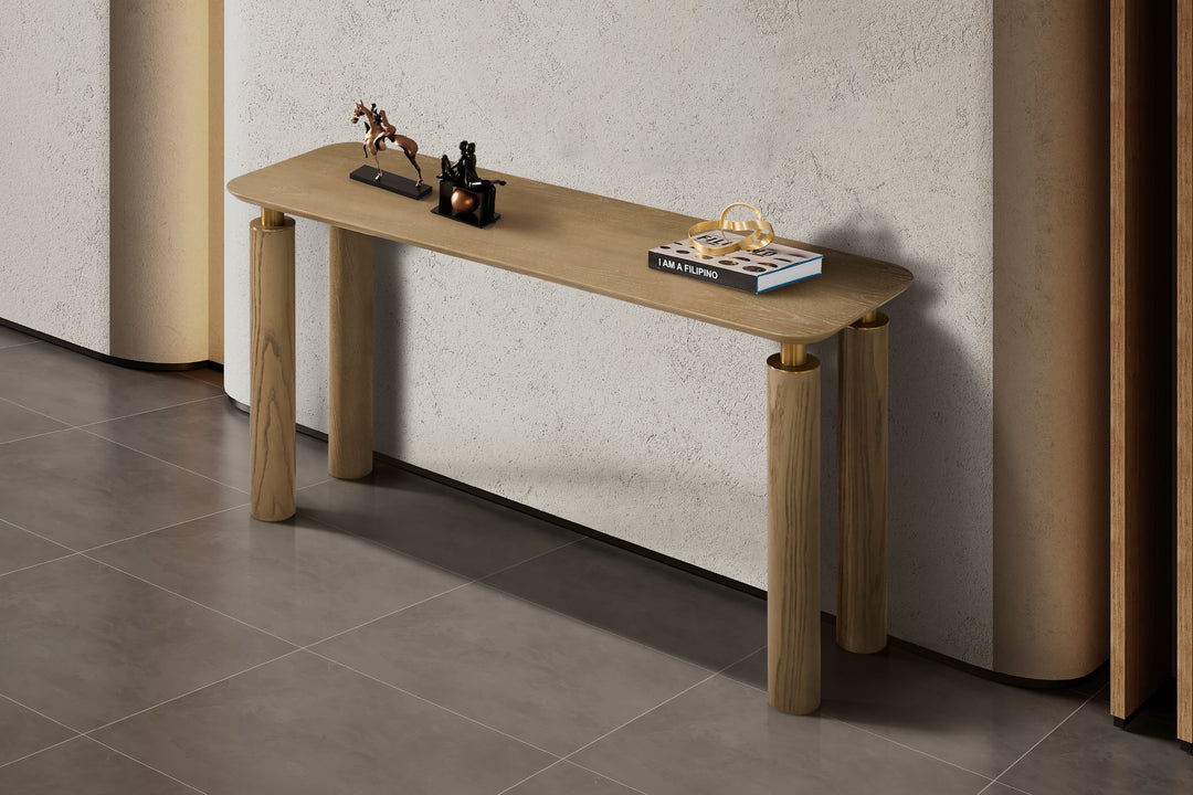 Wooden console table with decorative items against a neutral wall.