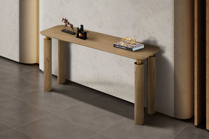 Wooden console table with decorative items against a neutral wall.