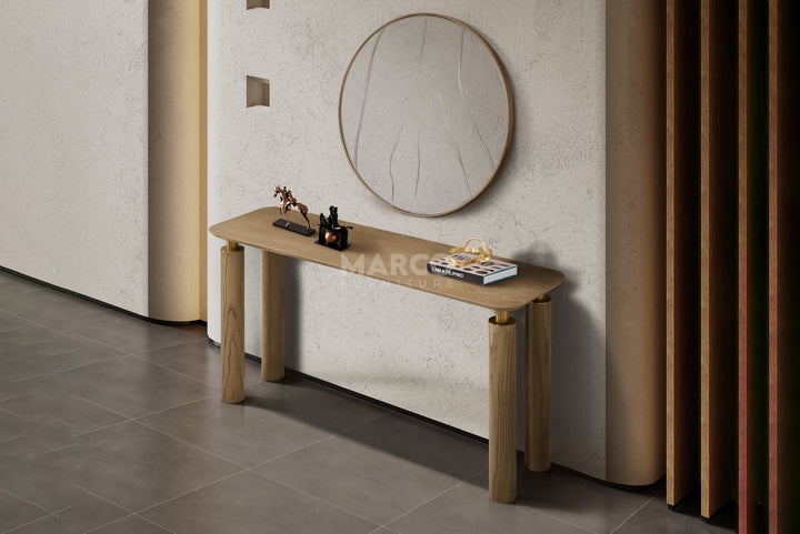 Wooden console table with decorative items against a neutral wall.