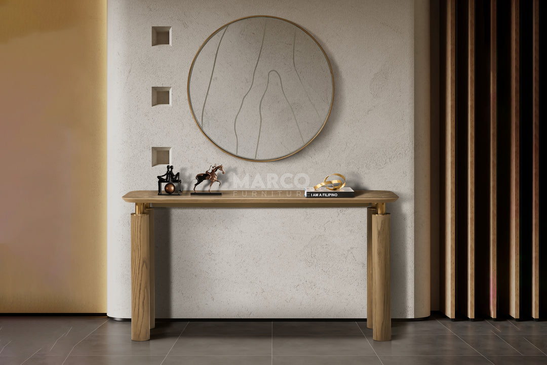 Wooden console table with decorative items against a neutral wall.