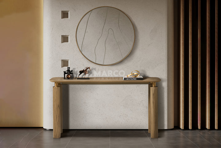 Wooden console table with decorative items against a neutral wall.