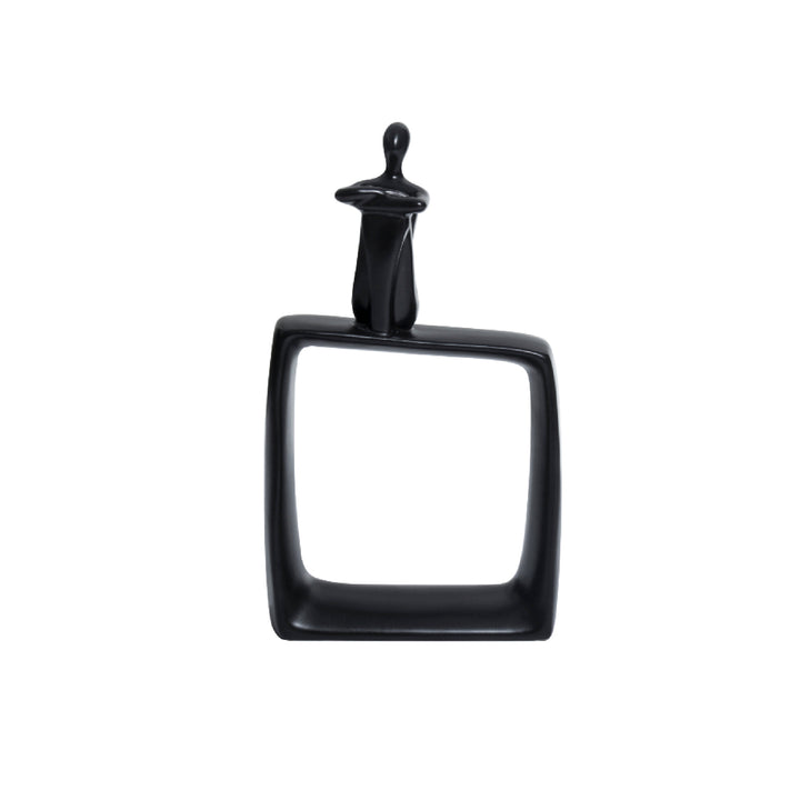 A black ceramic abstract art statue featuring a cubic base with a thinking man figure on top, placed against a white background.