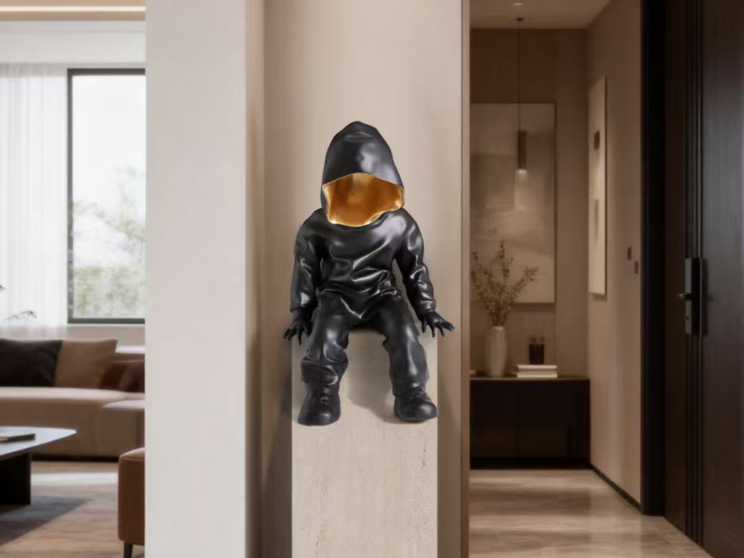 Black Hooded Gold-Faced Figurine
