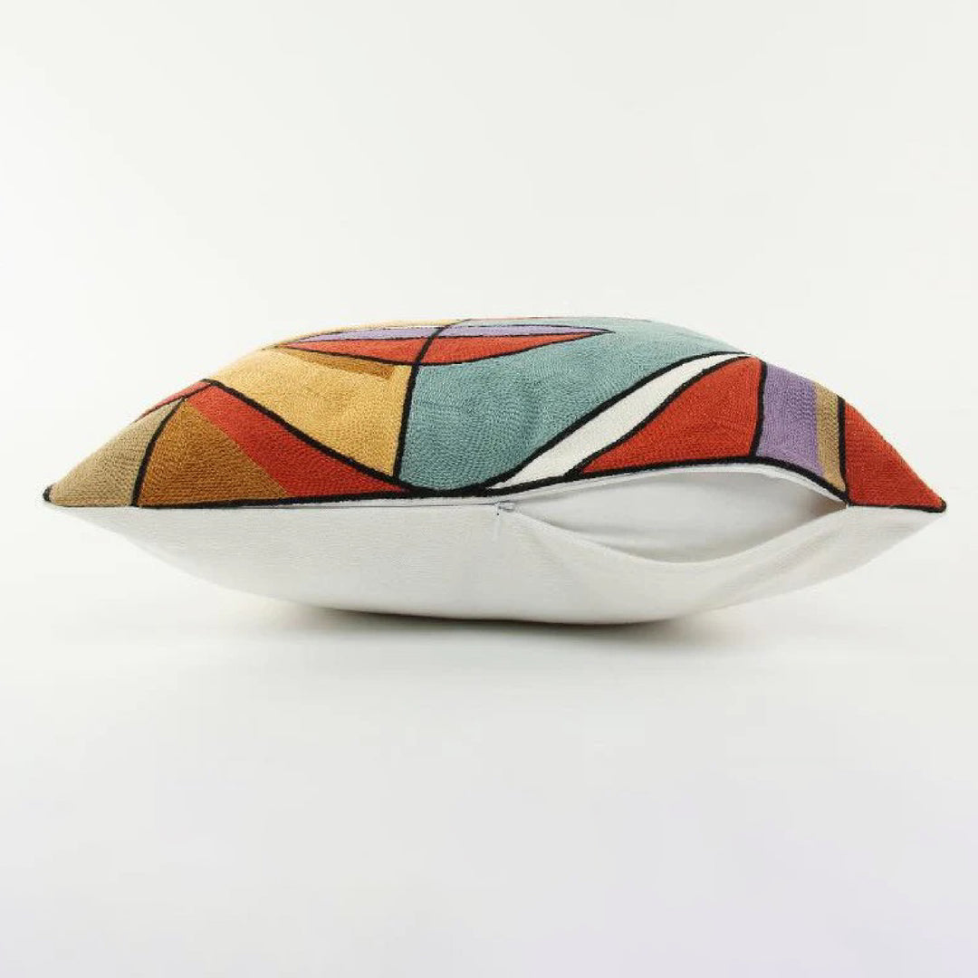 Decorative pillow with a colorful abstract pattern on a white background