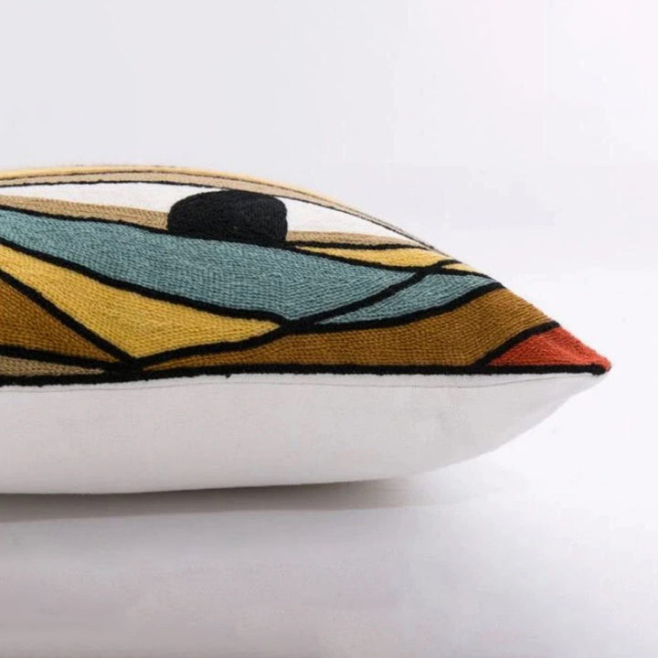 Decorative pillow with geometric pattern on a white background