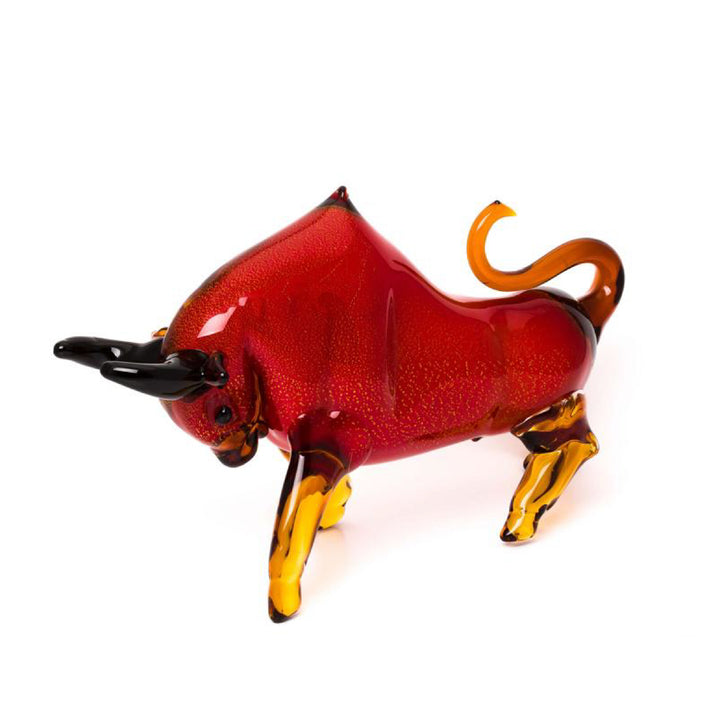 Glass bull figure with red and amber colors on a white background