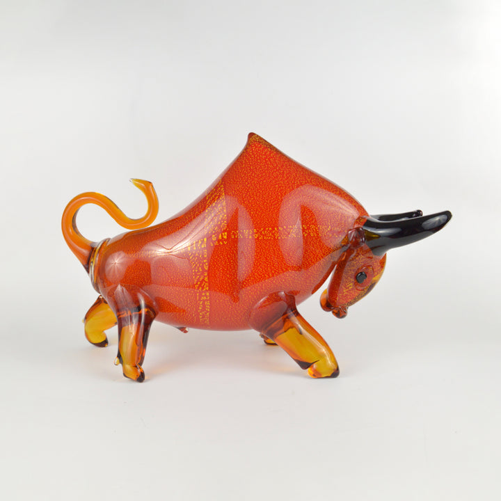 Glass bull figurine on a white background