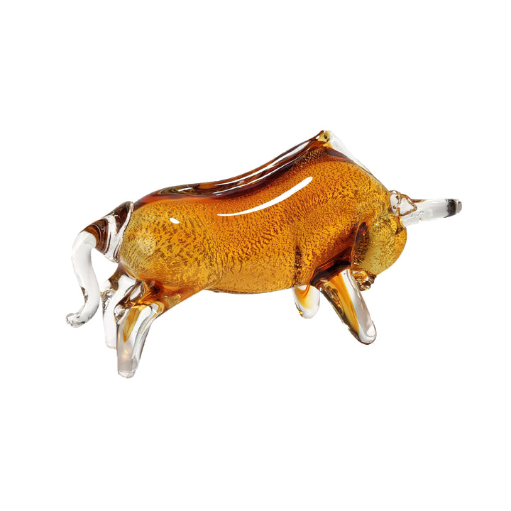 A gold-toned glass sculpture of a bull with a clear glass body and intricate detailing.