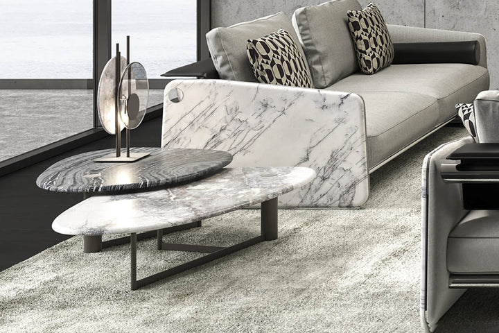 Modern living room with marble coffee table and sofa.