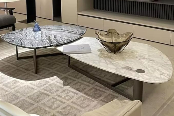 Modern living room with marble coffee table and decorative bowl.