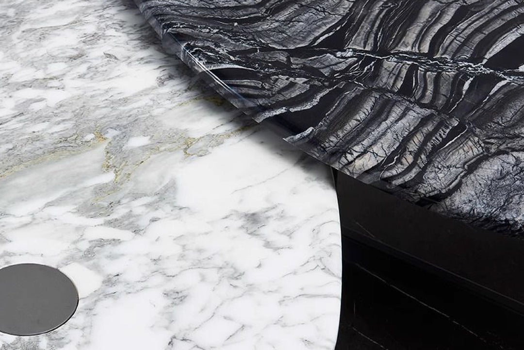 Close-up of black and white patterned fabric against a marble background.