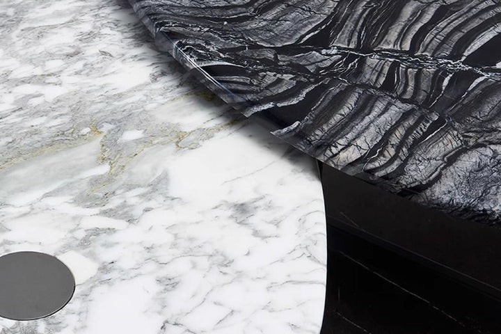 Close-up of black and white patterned fabric against a marble background.