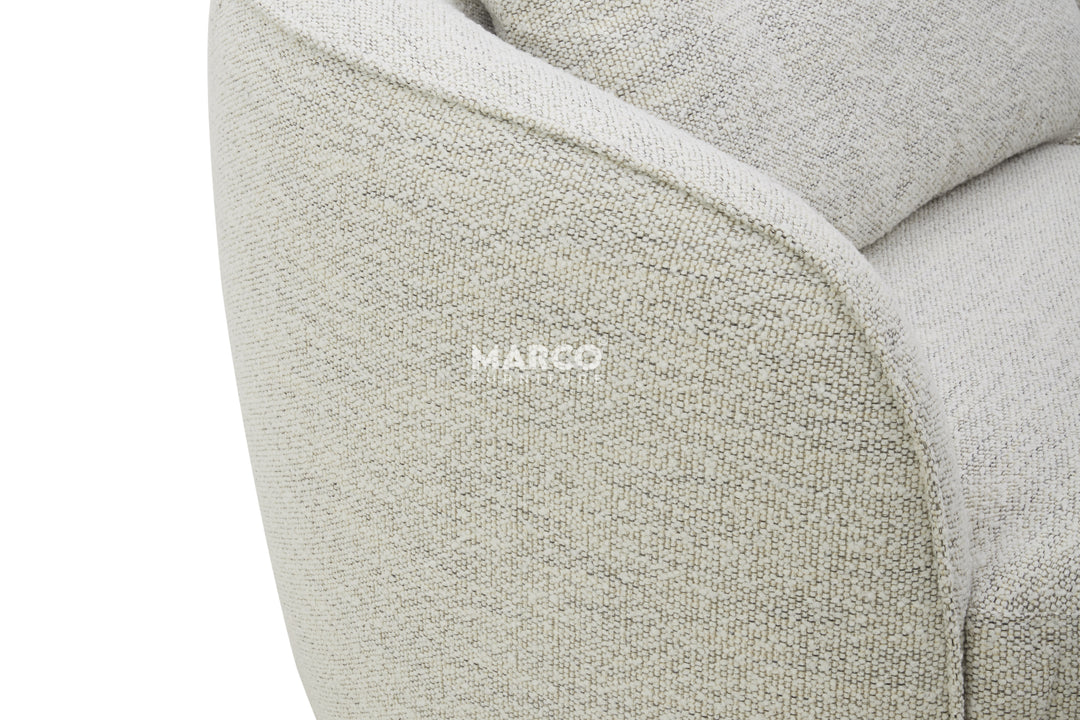 Close-up of a textured gray sofa with 'Margo' branding.