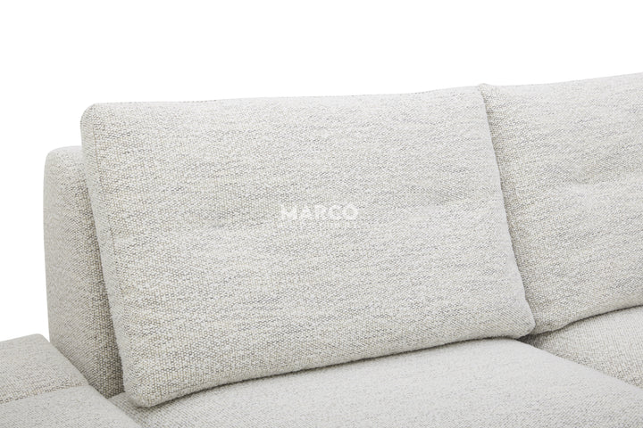 Gray sofa with 'MARCO' branding on a white background