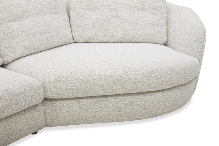 Close-up of a light gray sofa on a white background