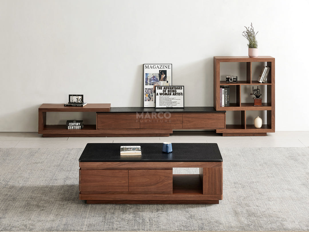 Wooden TV stand and coffee table with decorative items in a living room.