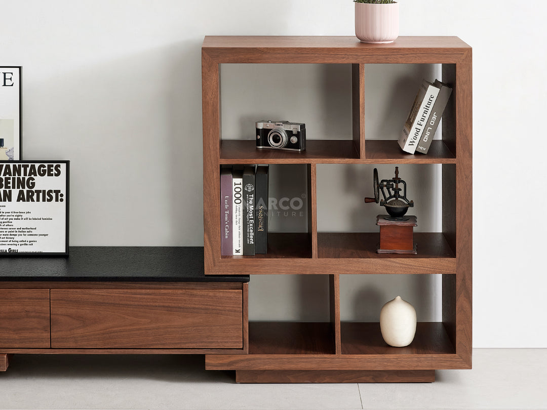 Wooden bookshelf with decorative items in a living room.