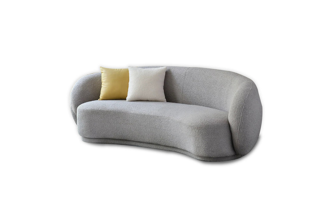 Gray sofa with two cushions on a white background