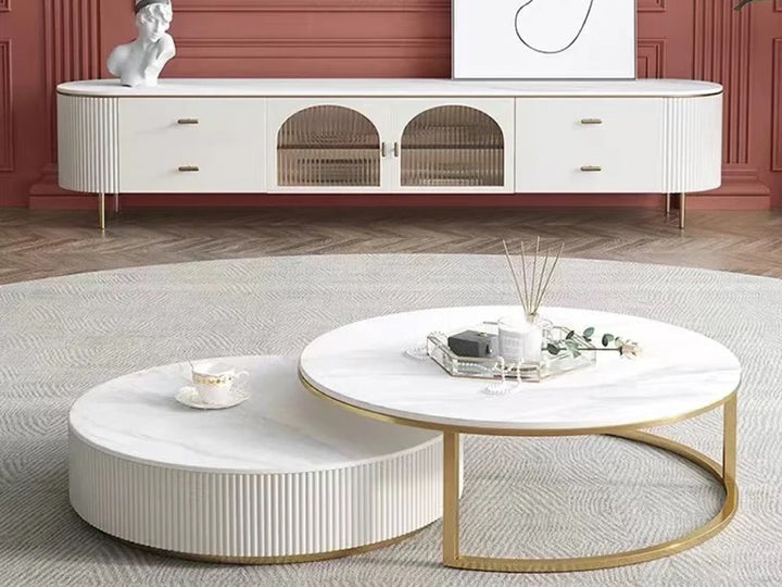 Modern living room with a white TV stand and coffee table.