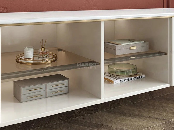 Shelving unit with decorative items against a red wall.