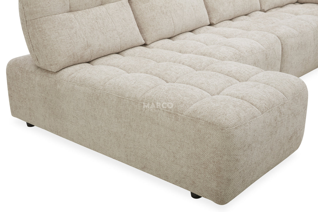 Beige sectional sofa with 'MARCO' branding on a white background