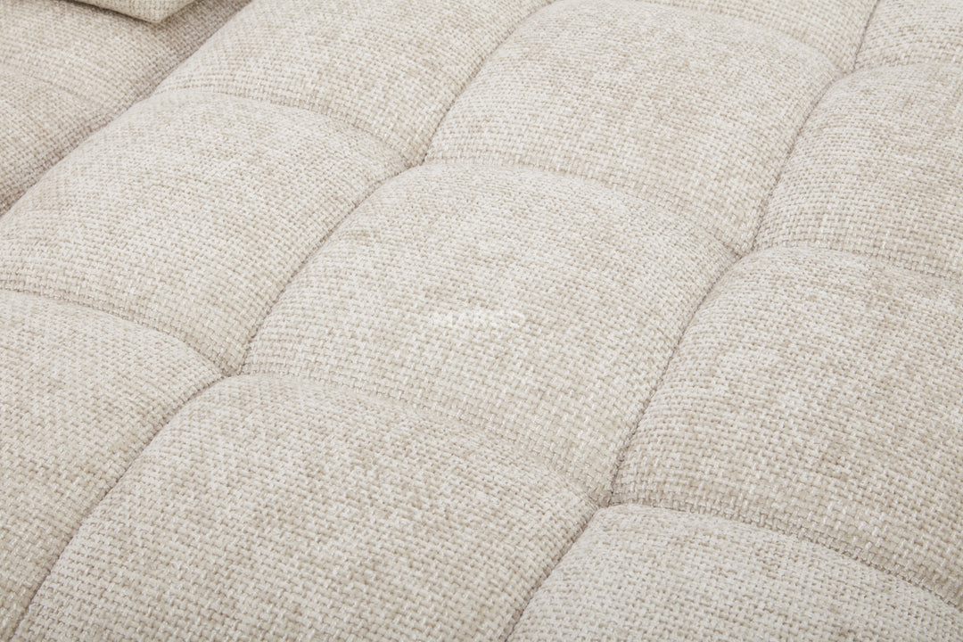 Close-up of a textured beige fabric surface