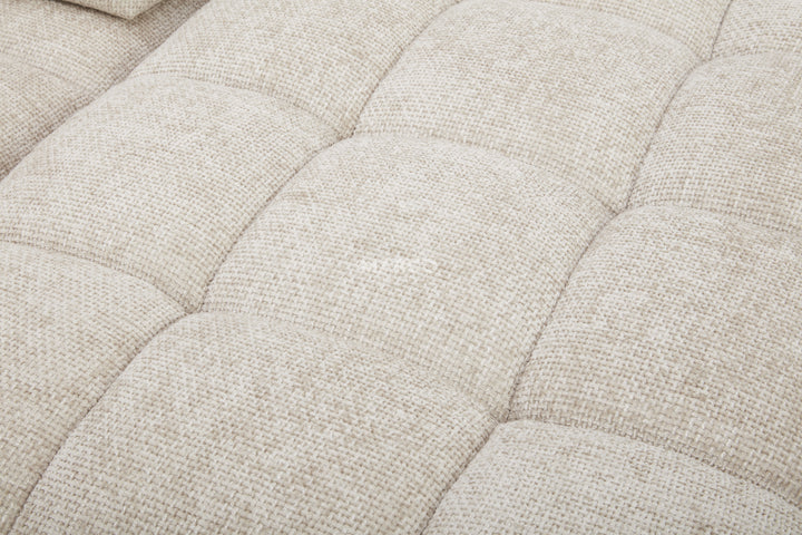 Close-up of a textured beige fabric surface