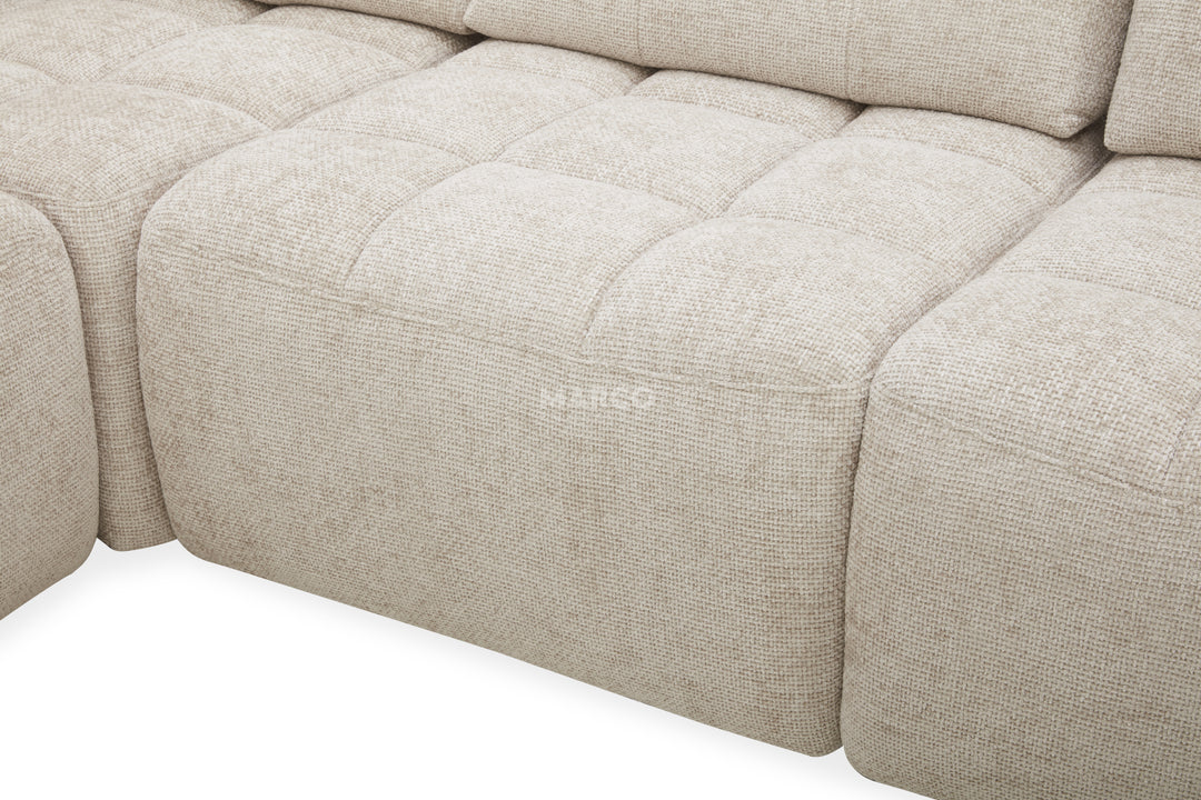 Beige fabric sofa with a visible brand logo on a white background